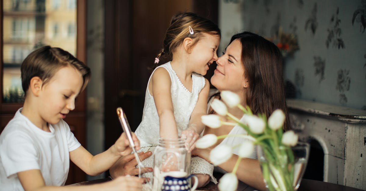 A joyful moment of a mother baking with her children in a cozy home environment.